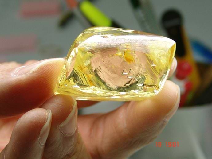A rough yellow diamond